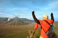 Man stay on the top near volcano Bromo in Indonesia