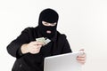Man stealing data from a laptop Royalty Free Stock Photo