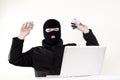 Man stealing data from a laptop Royalty Free Stock Photo