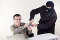 Man stealing data from a laptop Royalty Free Stock Photo