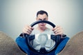 Man with a steering wheel, front view. Driver car concept