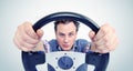 Man with a steering wheel, front view. Driver car concept Royalty Free Stock Photo