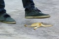 Man stepping on banana skin or peel, accident concept Royalty Free Stock Photo