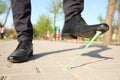 Man stepping in chewing gum on sidewalk