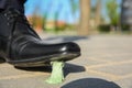 Man stepping in chewing gum on sidewalk