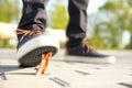 Man stepping in chewing gum on sidewalk