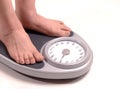 Man stepping on a scale Royalty Free Stock Photo