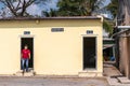 Man steps out of public toilet in Cai Be, Mekong Delta, Vietnam