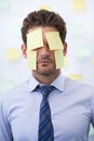 Man, sticky note and face for business schedule as work reminder or list for meeting, deadline or brainstorming. Male Royalty Free Stock Photo