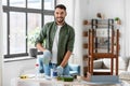 man stirring can with grey color paint at home Royalty Free Stock Photo