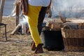 Man Stoking the Fire at a Historical Reenactment Royalty Free Stock Photo