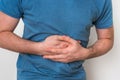 Man with stomach pain is holding his aching belly Royalty Free Stock Photo