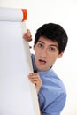Man stood by blank flip-chart Royalty Free Stock Photo
