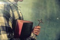 A young man holding a bible in his hands Royalty Free Stock Photo