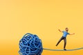 A man stood on a tangled ball of string. Overcoming stress and mental health. 3D Rendering