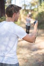 Man with stopwatch timing woman running Royalty Free Stock Photo