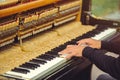 Man on the street playing the piano