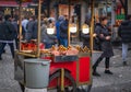 Street vendor selling roasted corns and chestnuts in a crowded street of Istanbul Royalty Free Stock Photo