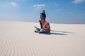 Man in stress, sits with laptop in the middle of the desert Royalty Free Stock Photo