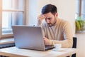 Man stressed while working on laptop. Royalty Free Stock Photo