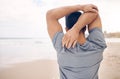 Man, stretching and arms on beach, exercise and warm up for fitness, ready and workout by ocean. Male person, back and Royalty Free Stock Photo