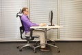 Man stretching arms,exercising on chair Royalty Free Stock Photo