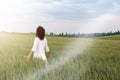 Man Striding through field of cereal plant