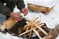 A man strikes a match to make a fire. Royalty Free Stock Photo