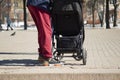 a man with a stroller, where a child is sitting on a city street Royalty Free Stock Photo