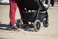 a man with a stroller, where a child is sitting on a city street Royalty Free Stock Photo