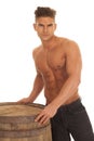 Man strong no shirt barrel touch serious Royalty Free Stock Photo