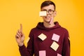 Man student in glasses on a yellow background, pasted with stickers. Face and body stickers Royalty Free Stock Photo