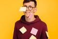 Man student in glasses on a yellow background, pasted with stickers. Face and body stickers Royalty Free Stock Photo