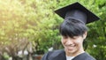 Man student smiles and feel happy in graduation gowns and cap Royalty Free Stock Photo