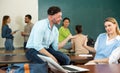 Man student trying to flirt with woman in classroom Royalty Free Stock Photo