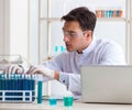 Man student working in chemical lab on experiment Royalty Free Stock Photo