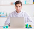 Man student working in chemical lab on experiment Royalty Free Stock Photo