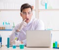 Man student working in chemical lab on experiment Royalty Free Stock Photo