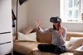 Man In Studio Wearing Virtual Reality Headset Playing Game Royalty Free Stock Photo