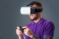 Man in studio wearing virtual reality headset playing game Royalty Free Stock Photo