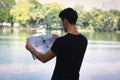 Man Studying Map by the Lake Royalty Free Stock Photo