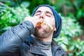 Man stuffing his face with food and feeling nice Royalty Free Stock Photo