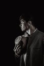 The man in style Chicago gangster with cigar on dark background