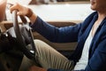 Elegant happy man in good new car in sale centre Royalty Free Stock Photo