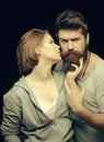 Man with stylish beard. Fashion shot of couple after haircut. Barbershop concept. Woman on mysterious face with bearded