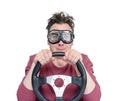 Man in stylish goggles with steering wheel, isolated on white background. Car driver concept Royalty Free Stock Photo