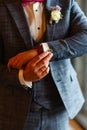 A man in a stylish suit straightens cuffs on his shirt. Shooting of a businessman in a suit. Business concept. Close-up of a man i Royalty Free Stock Photo