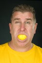 Man sucking on lemon