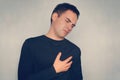 Heartache, man suffering from chest pain, having heart attack or painful cramps, pressing on chest with painful expression Royalty Free Stock Photo