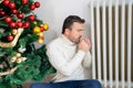 Man suffering cold at home and problem with house heating during Christmas Royalty Free Stock Photo